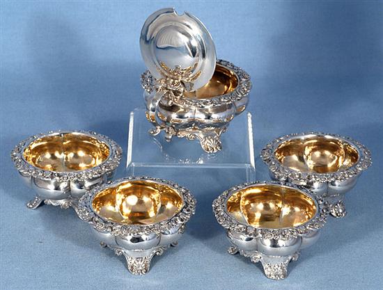 A set of four George III provincial silver table salts with matching mustard, Diameter 3 ¾”/94mm combined weight 21.5oz/609grm